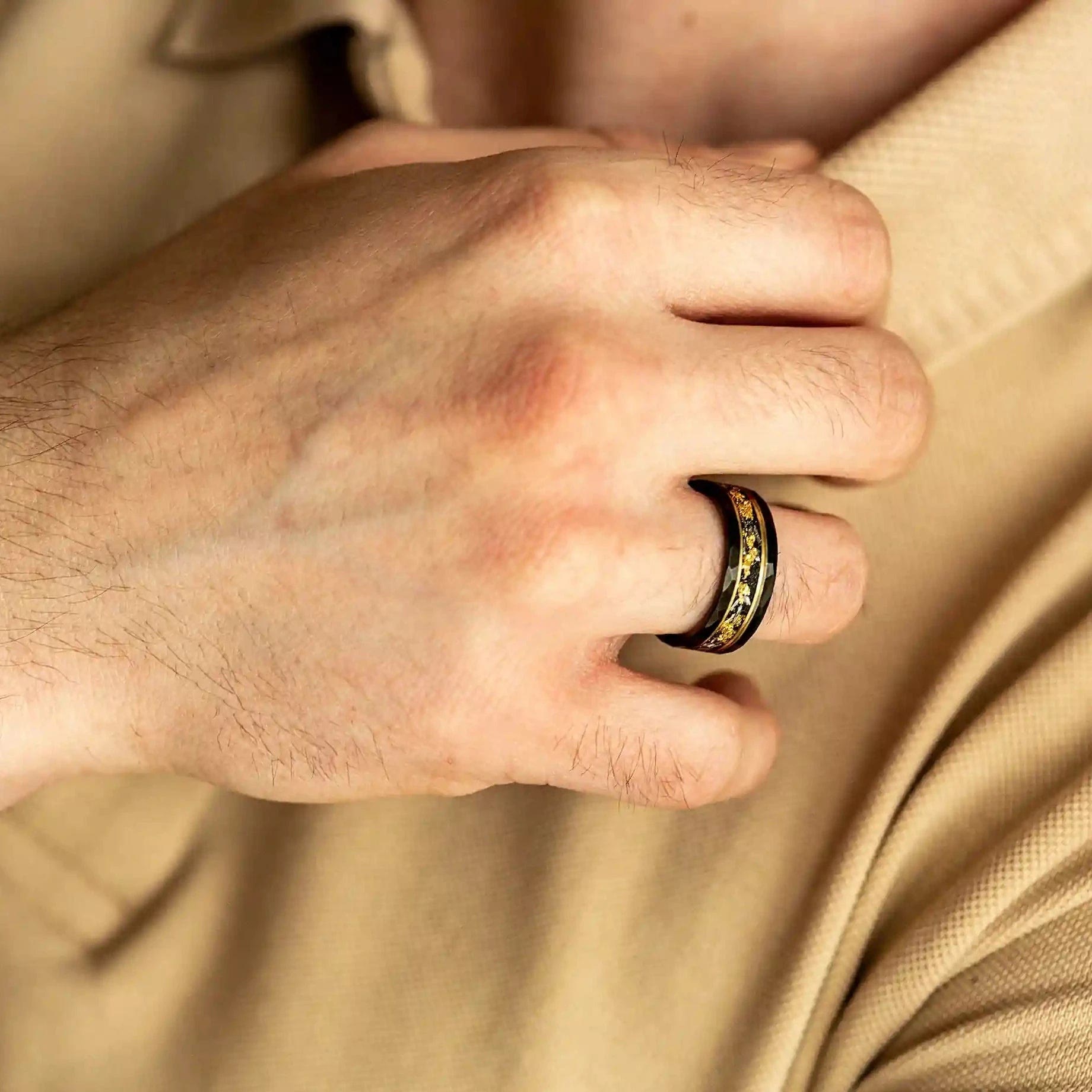 Elegant Orion Ring in Black Meteorite with Luxurious Gold Leaf Details