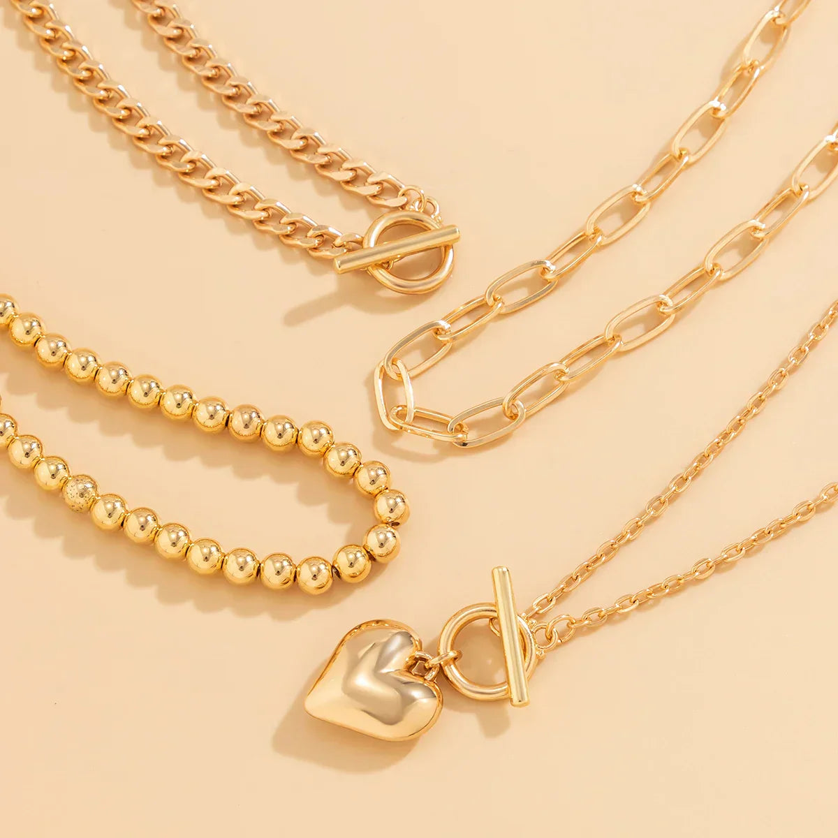 HeartGleam Necklace Set – Elegant Gold Heart Pendants