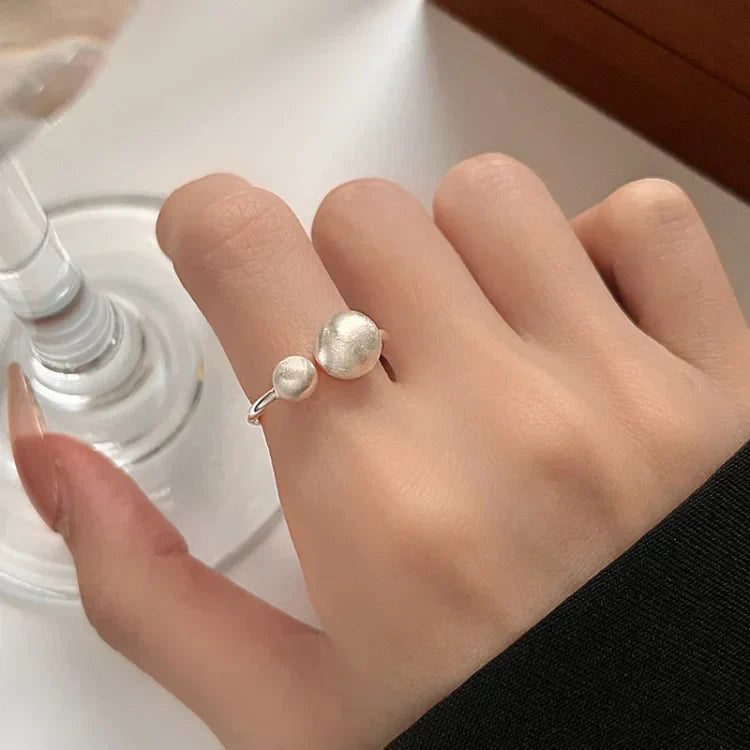 Elegant Brushed Silver Ring with Refined Interwoven Pearls - Elara