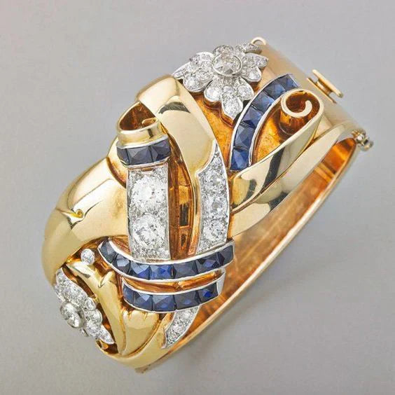 Celia's timeless vintage gold ring with stunning blue zirconia 